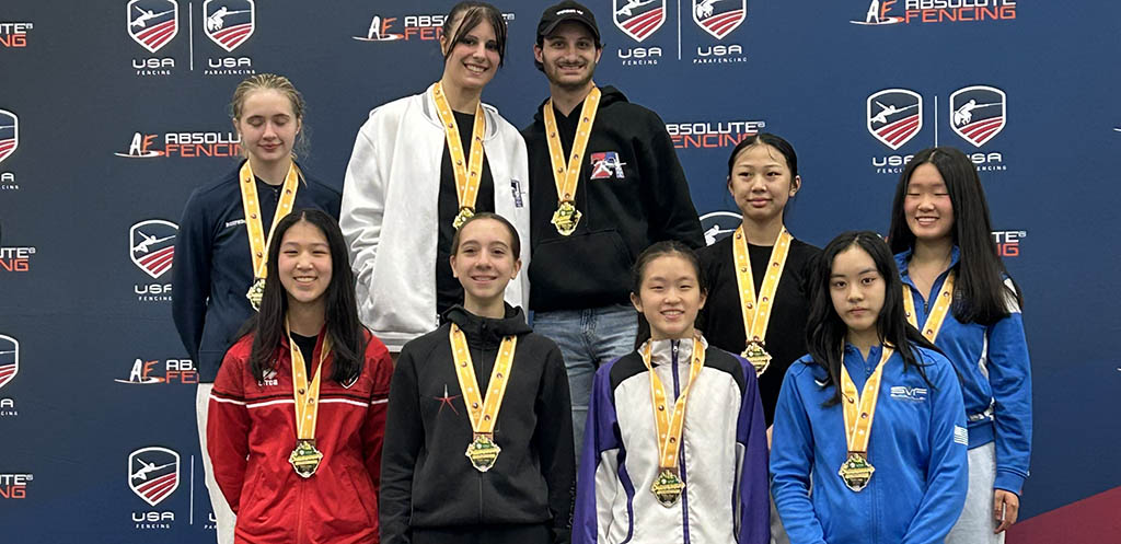 Division 1-A medalists posing together with their medals